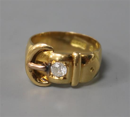 A late Victorian 18ct gold and diamond set buckle ring by Constantine & Floyd, size M.